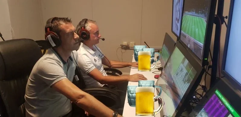 VAR Office with referees having eyes closed and beer on the table