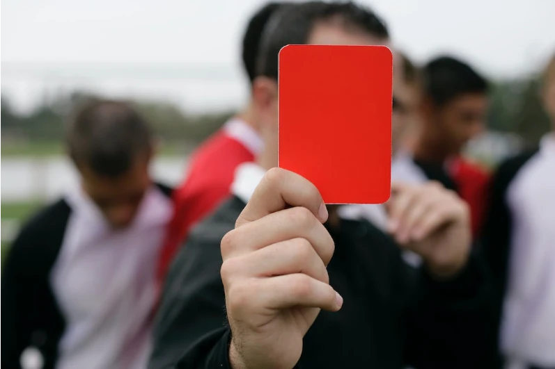 Referee holding Red Card