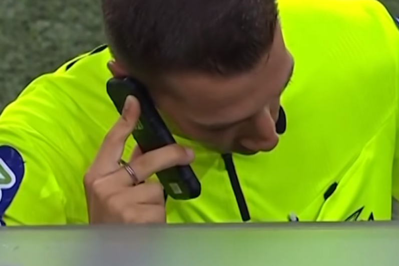 Referee calling VAR by Phone